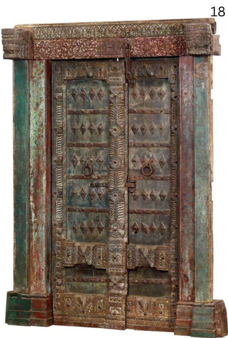 Pair of distressed painted wooden doors with diamond patterns